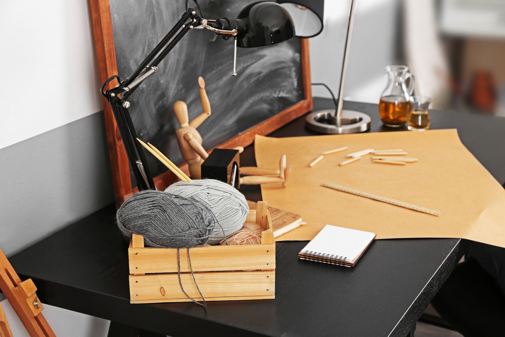 Atelier workspace with hoops and threads